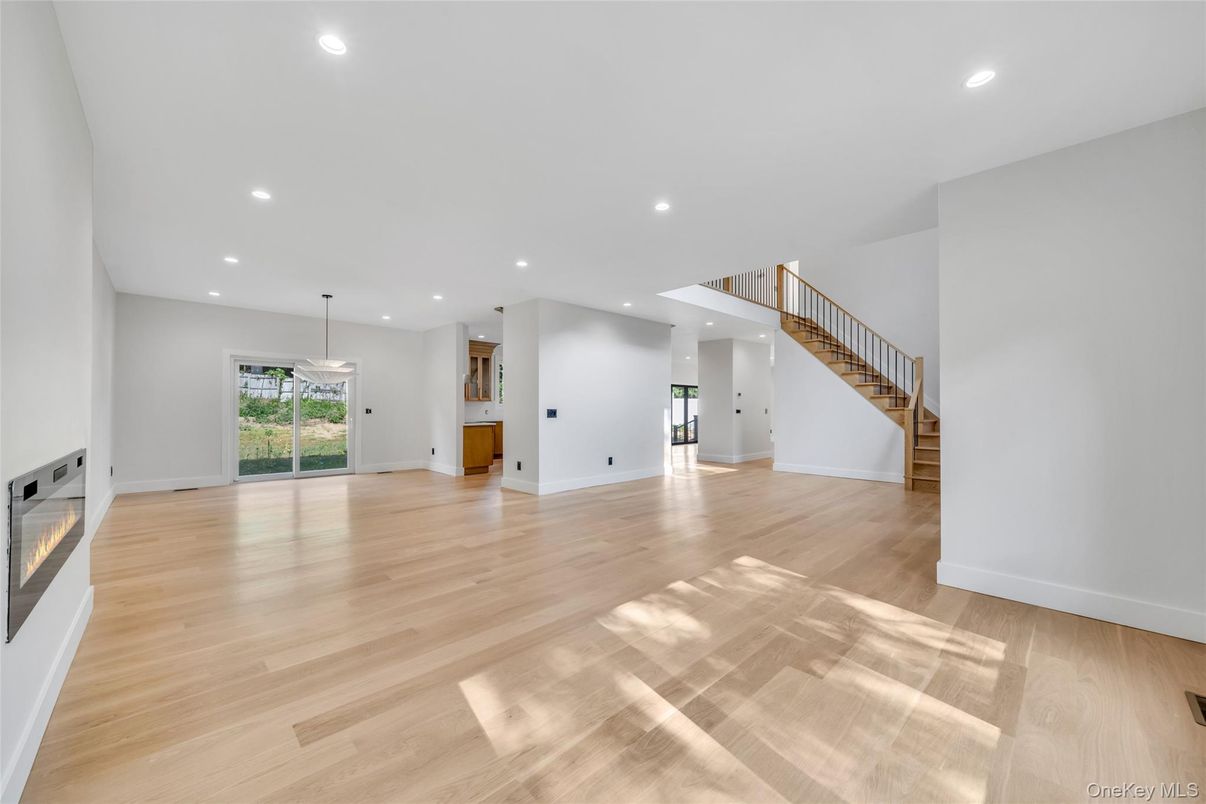 Empty room, Fireplace, Interior, Pendant Lights, Recessed Lighting, Wood Texture Flooring