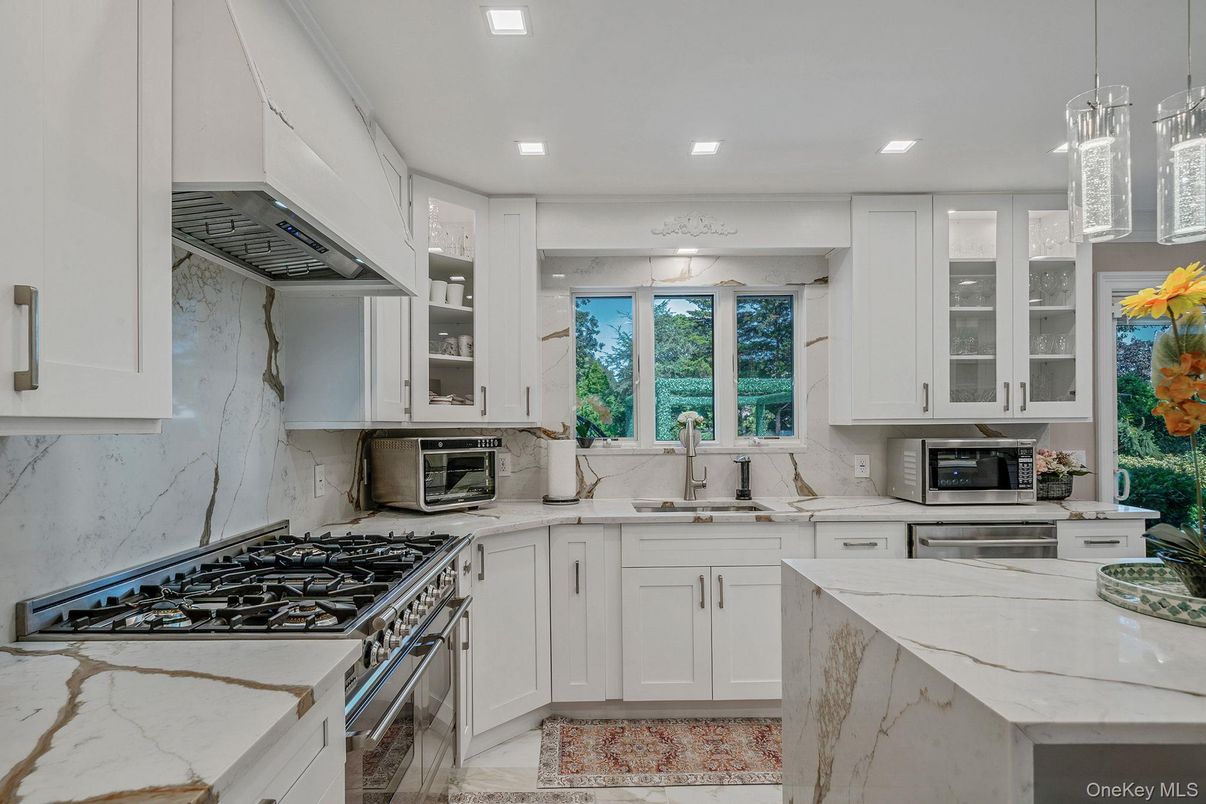 Interior, Kitchen, Marble Walls, Pendant Lights, Recessed Lighting, Stainless Steel Appliances
