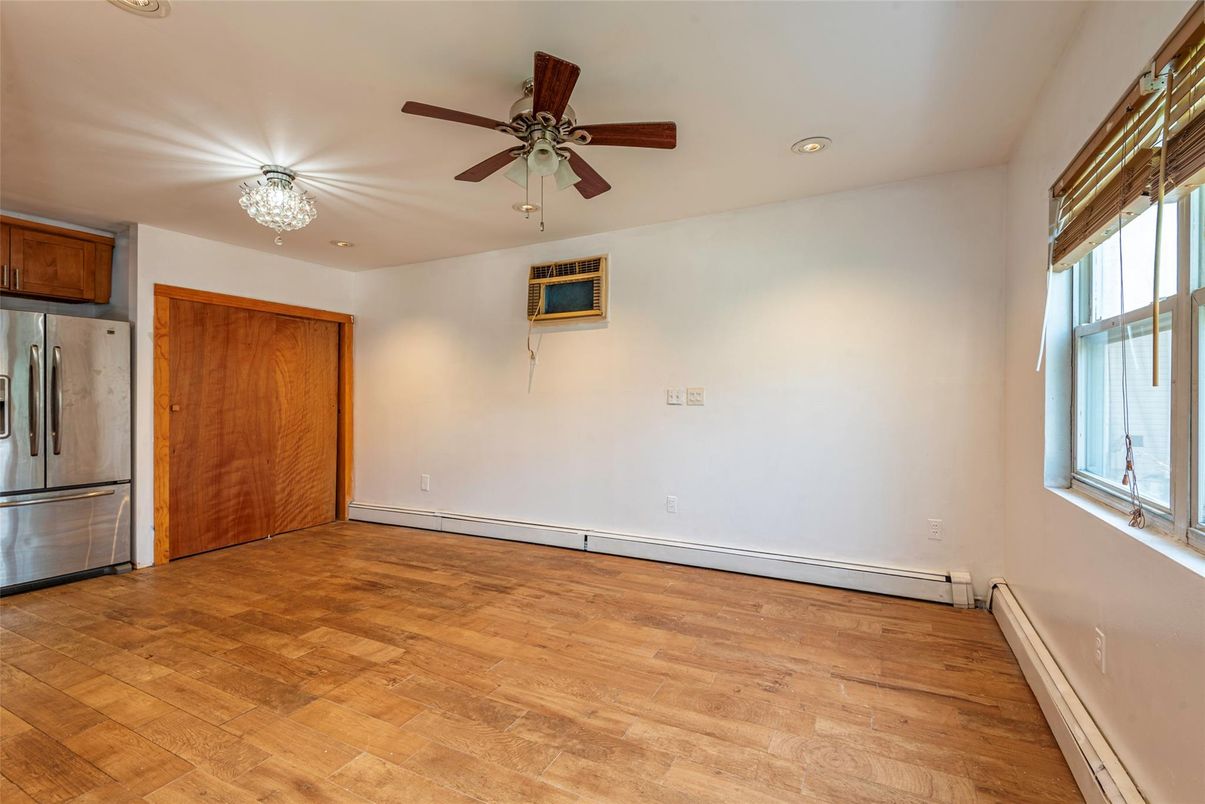Chandelier, Empty room, Interior, Kitchen, Recessed Lighting, Stainless Steel Appliances, Wood Texture Flooring