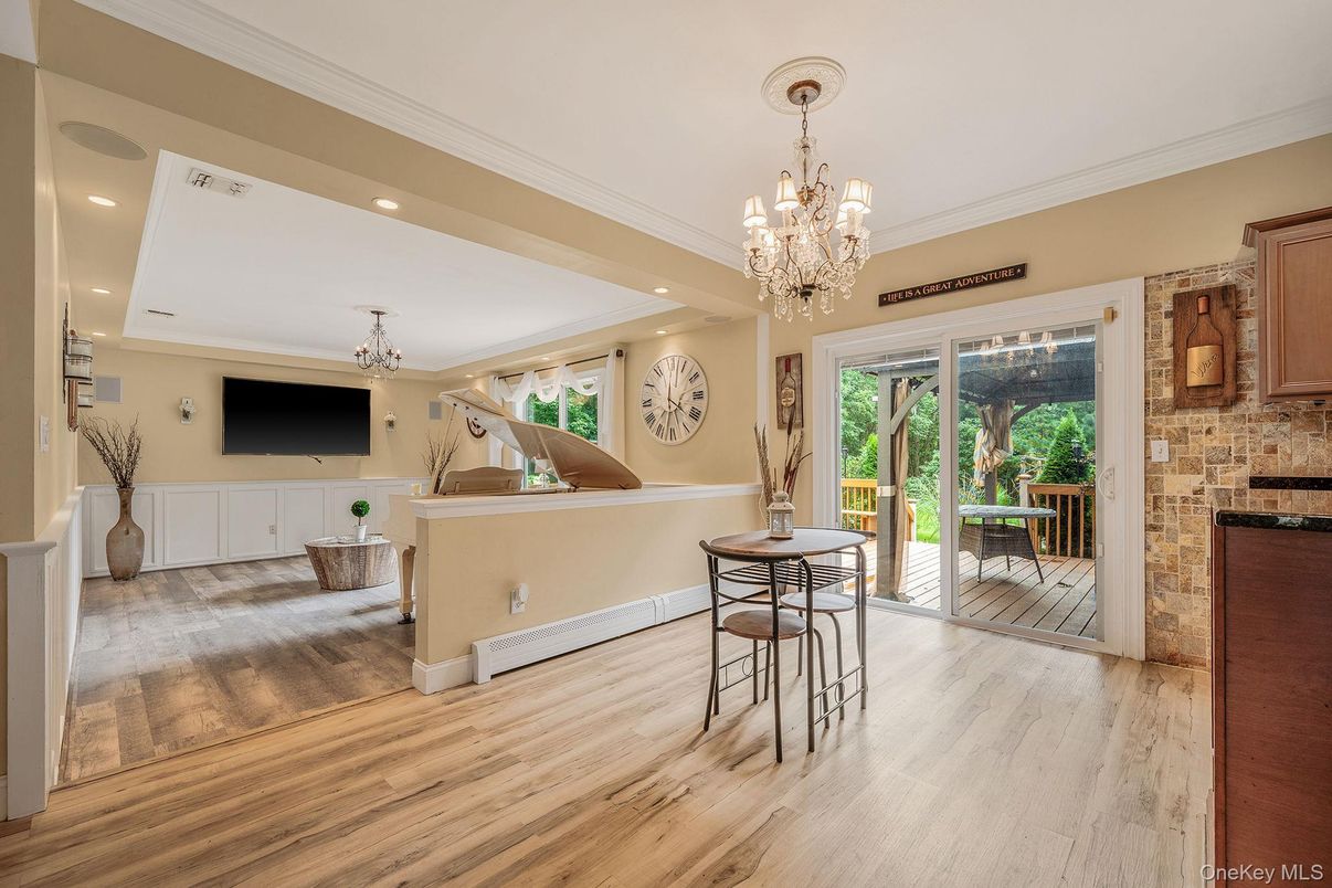 Chandelier, Dining room, Fireplace, Interior, Recessed Lighting, Stone Walls, Wood Texture Flooring