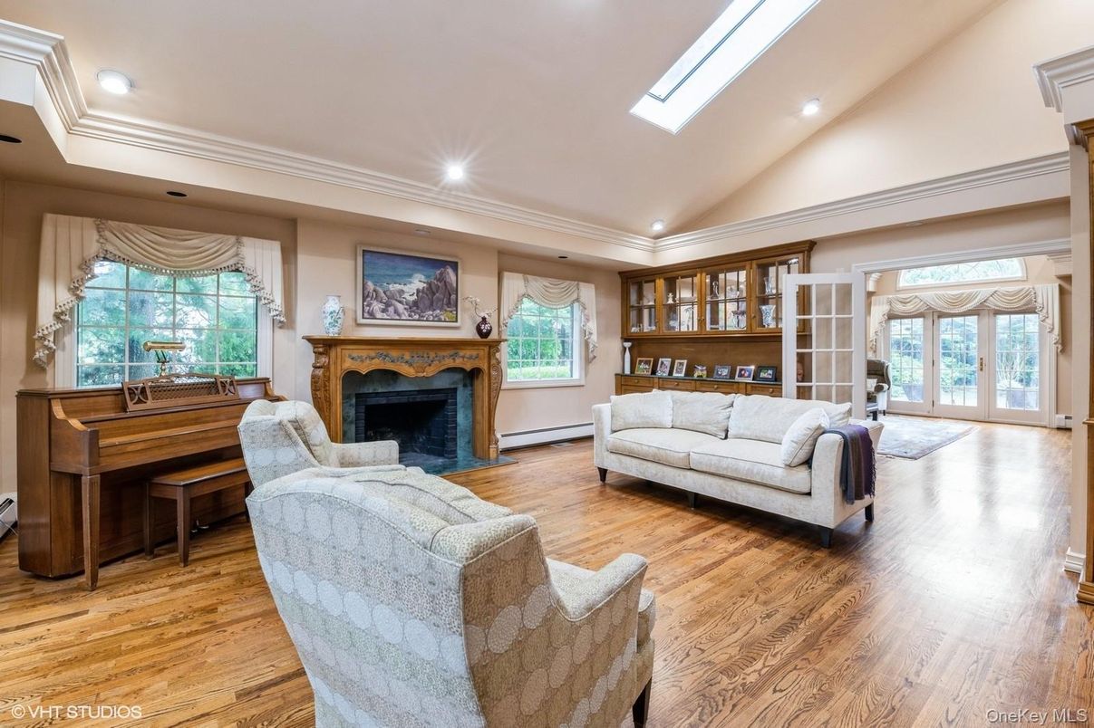 Fireplace, Interior, Living room, Piano, Recessed Lighting, Wood Texture Flooring