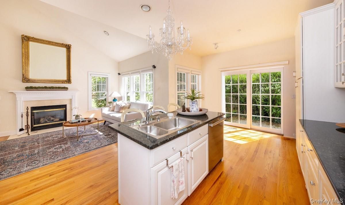 Chandelier, Fireplace, Interior, Living room, Recessed Lighting, Wood Texture Flooring