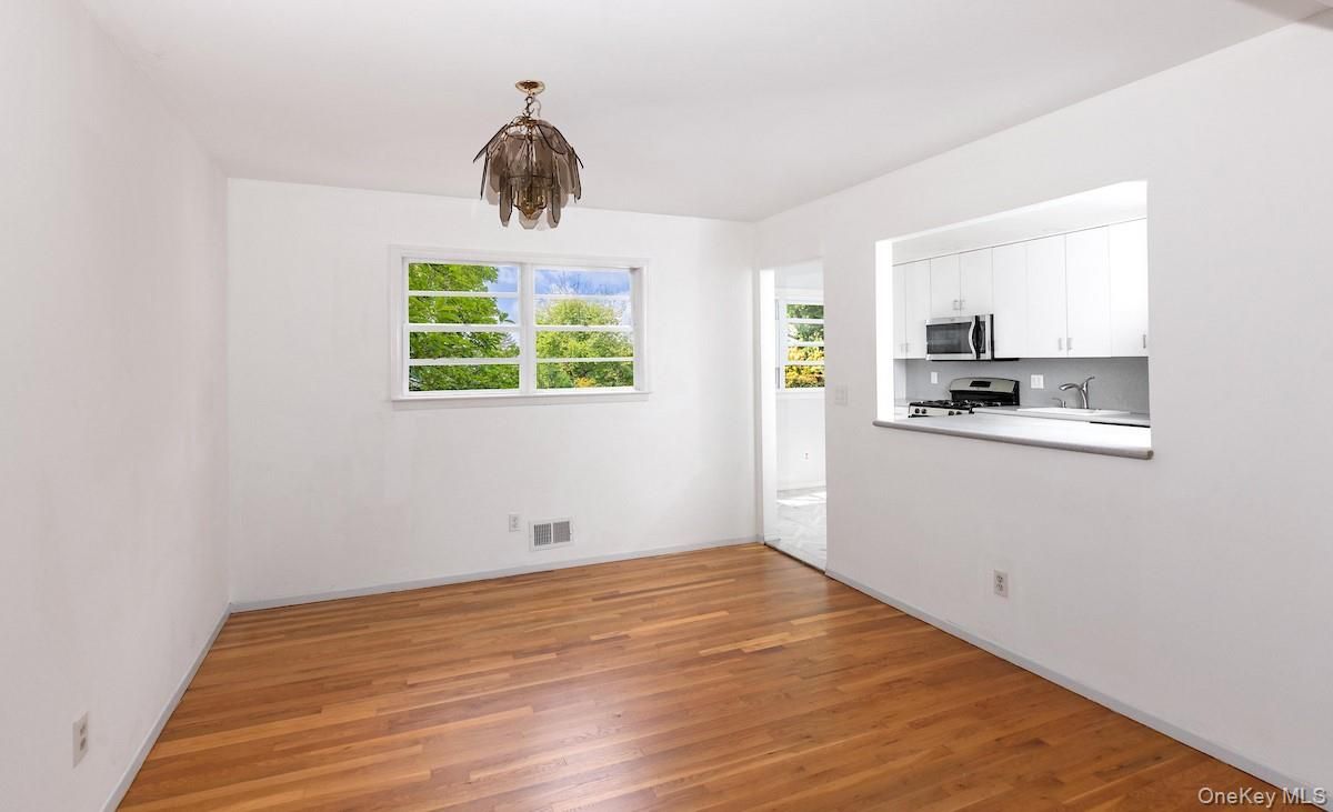 Empty room, Interior, Kitchen, Stainless Steel Appliances, Wood Texture Flooring