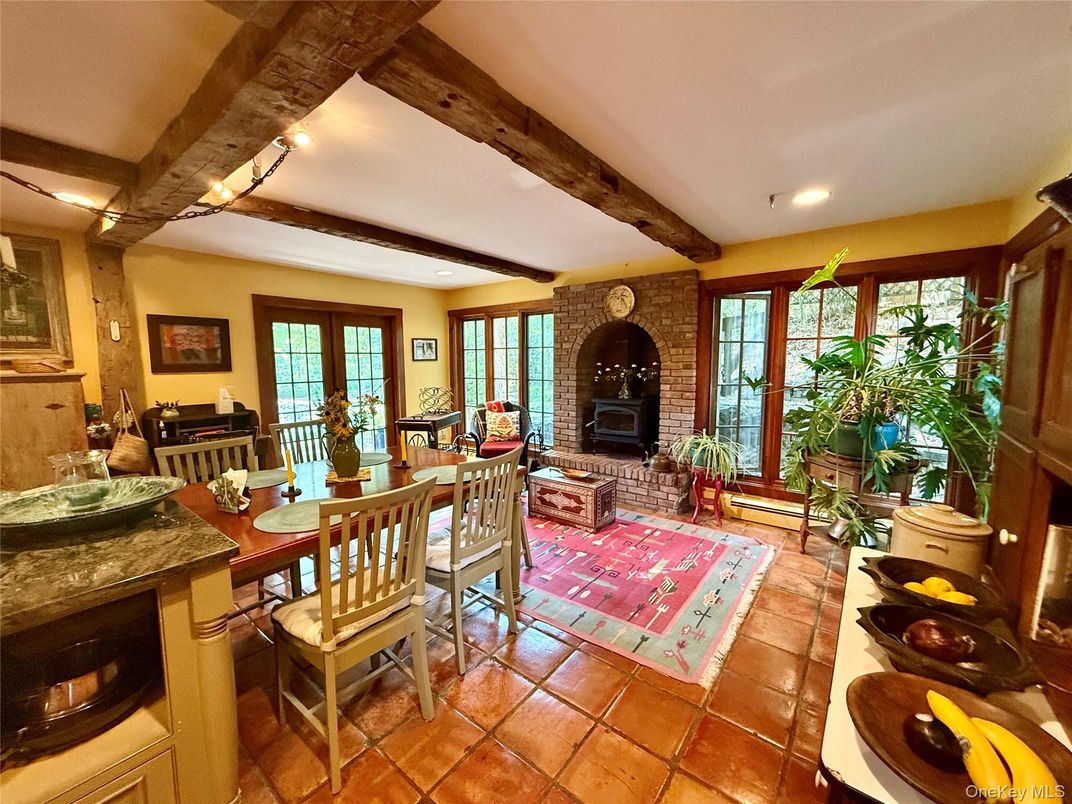 Dining room, Fireplace, Interior, Living room, Recessed Lighting, Stone Walls, Wooden Beams