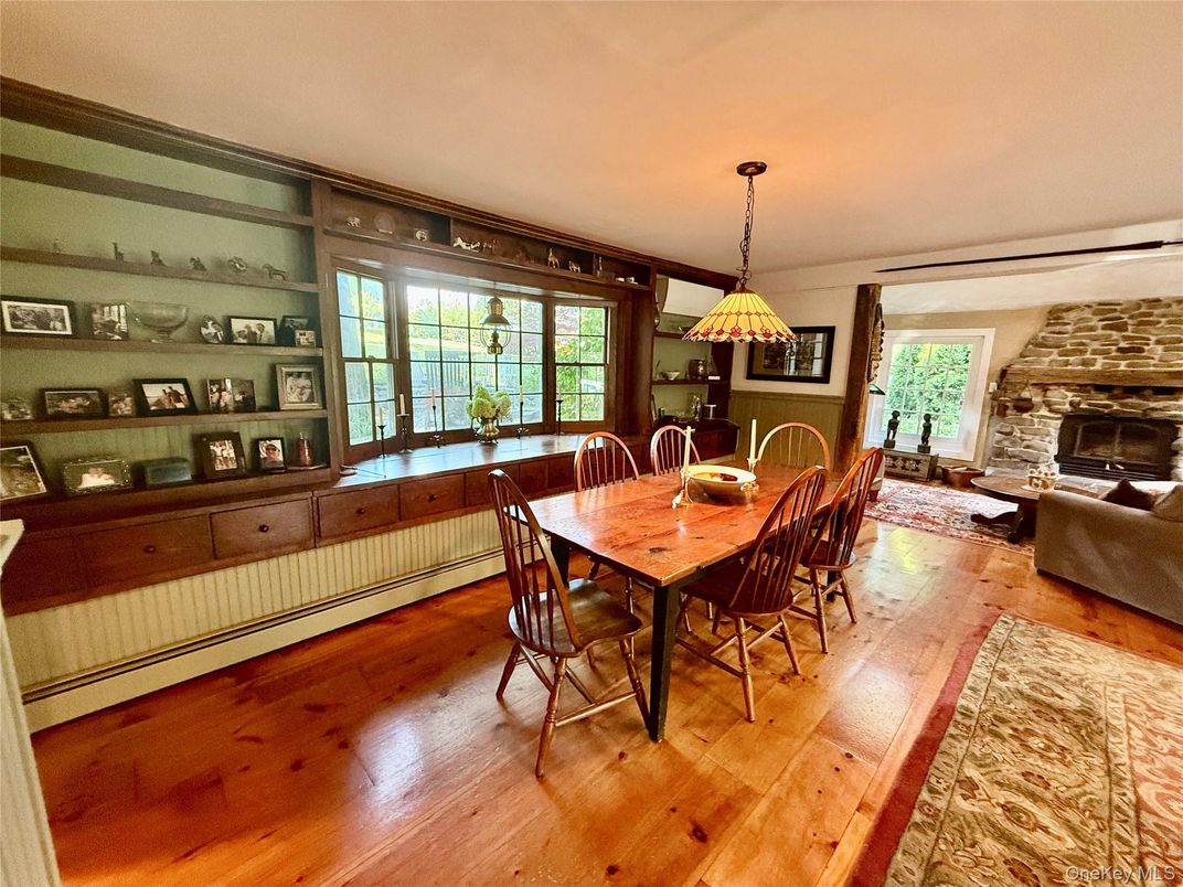 Dining room, Fireplace, Interior, Living room, Pendant Lights, Stone Walls, Wood Texture Flooring
