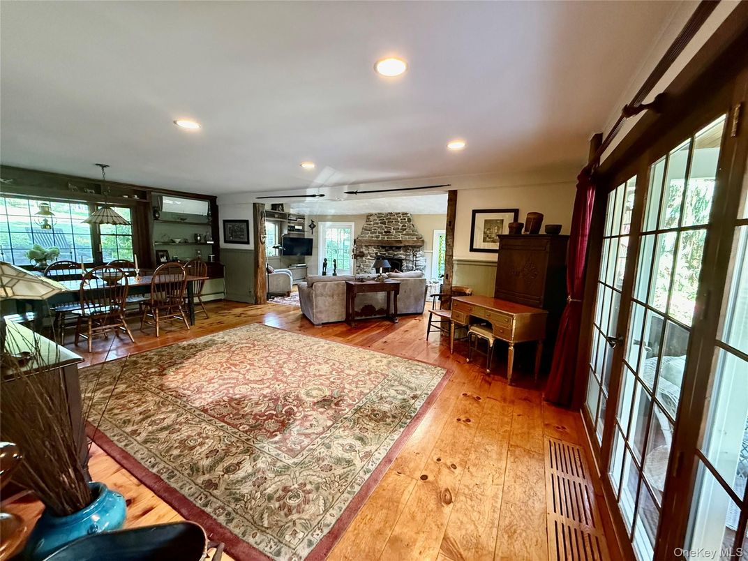 Dining room, Fireplace, Interior, Living room, Piano, Recessed Lighting, Wood Texture Flooring