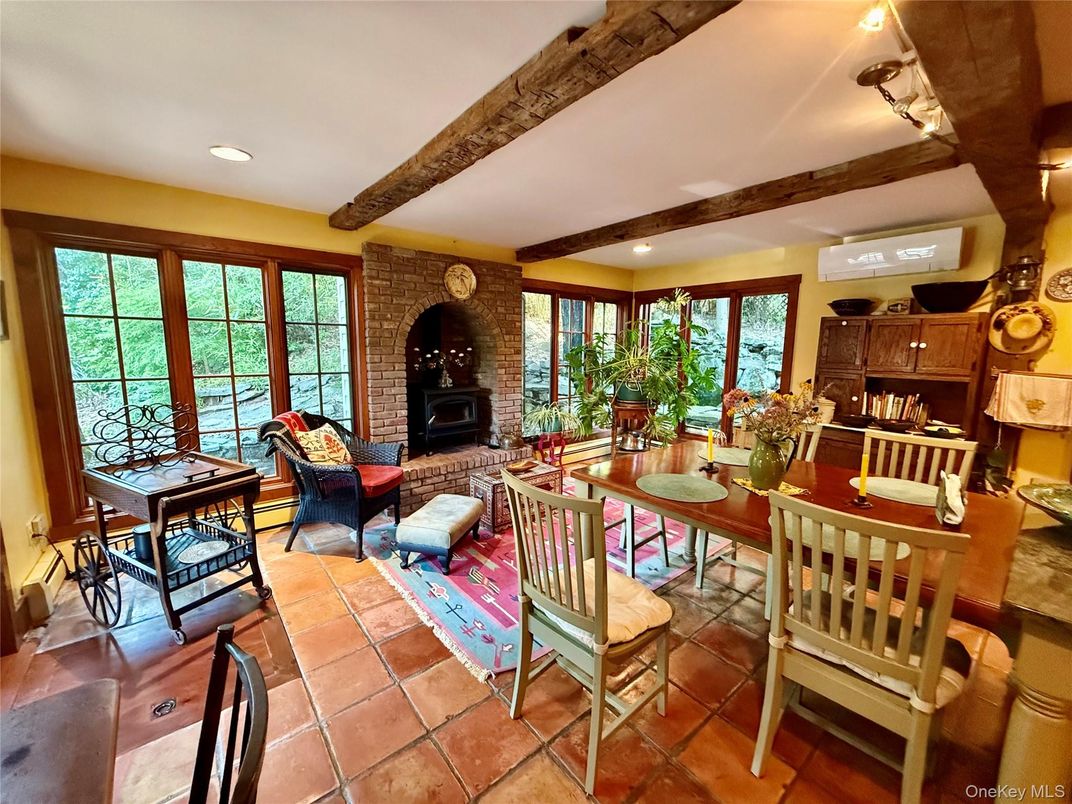 Dining room, Fireplace, Interior, Living room, Recessed Lighting, Stone Walls, Wooden Beams
