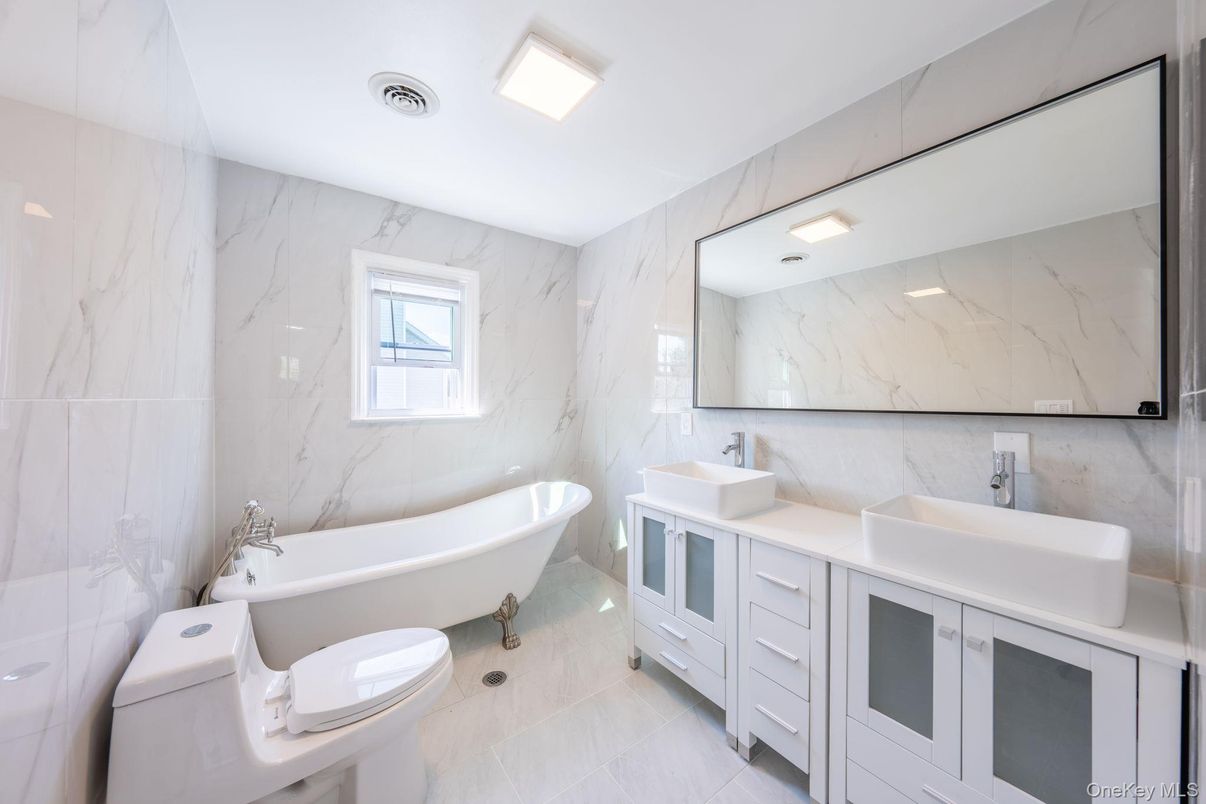 Bathroom, Dual Sink Vanities, Free Standing Baths, Interior, Marble Walls, Recessed Lighting