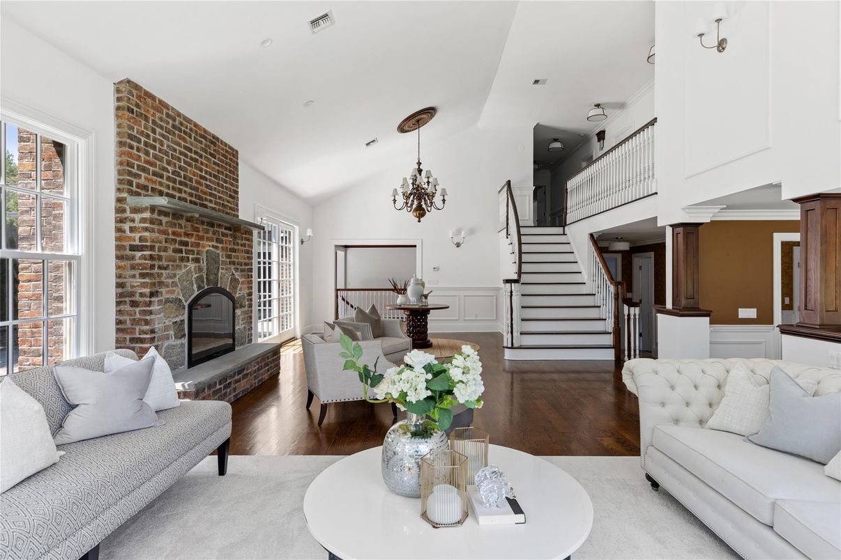 Chandelier, Dining room, Fireplace, Interior, Living room, Pendant Lights, Recessed Lighting, Stone Walls, Wood Texture Flooring