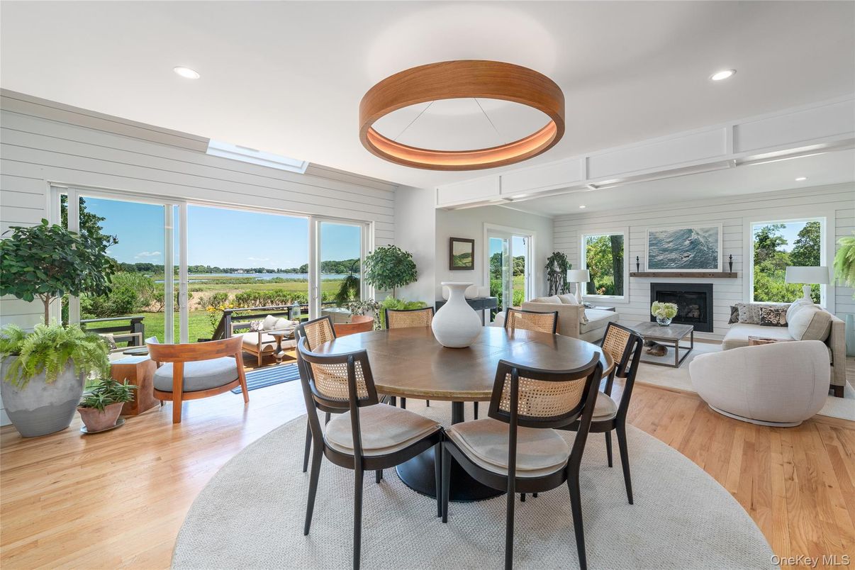 Dining room, Fireplace, Interior, Living room, Pendant Lights, Recessed Lighting, Wood Texture Flooring