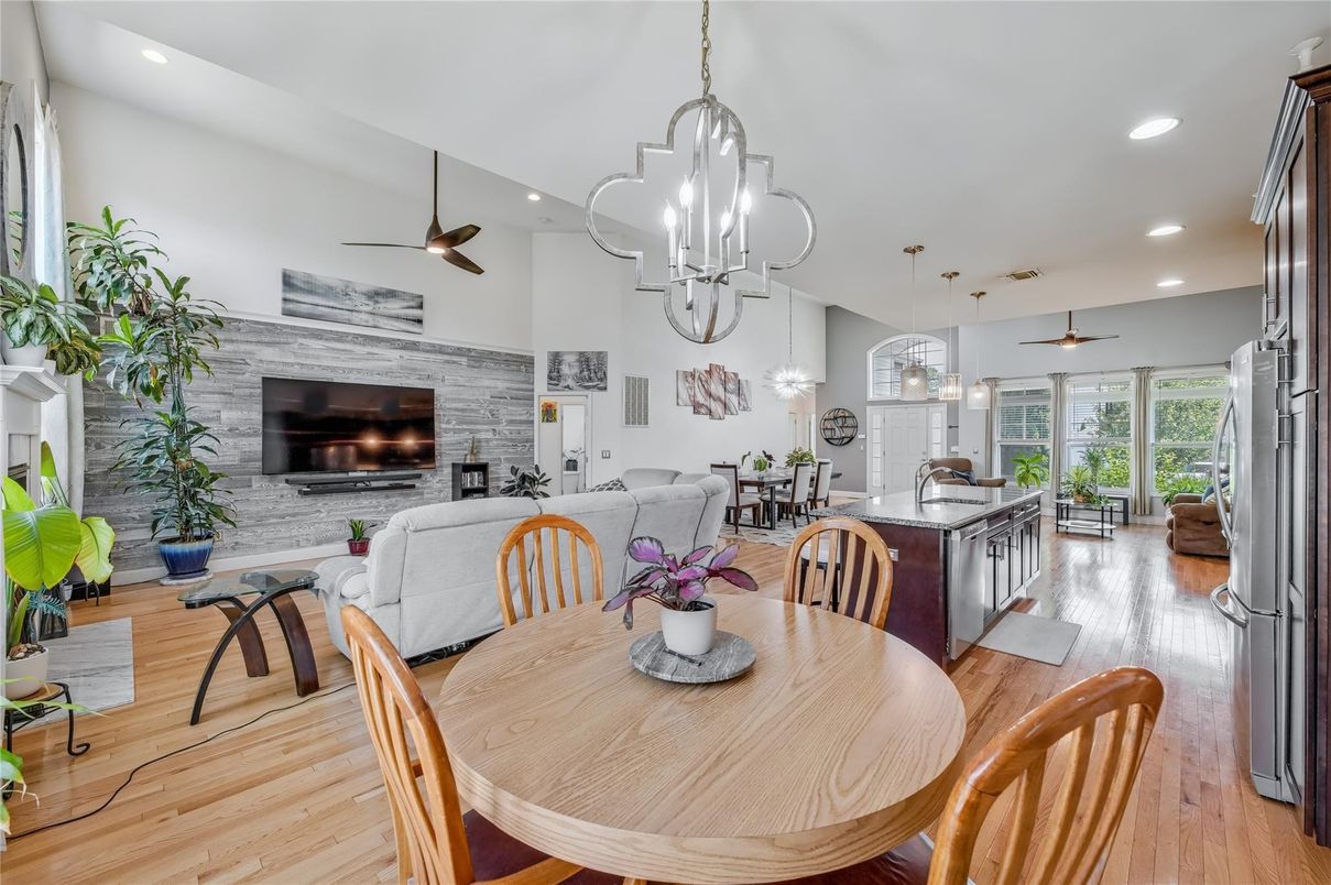 Dining room, Fireplace, Interior, Living room, Pendant Lights, Recessed Lighting, Stone Walls, Wood Texture Flooring