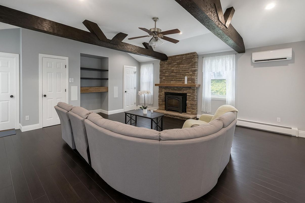 Fireplace, Interior, Living room, Recessed Lighting, Stone Walls, Wooden Beams, Wood Texture Flooring
