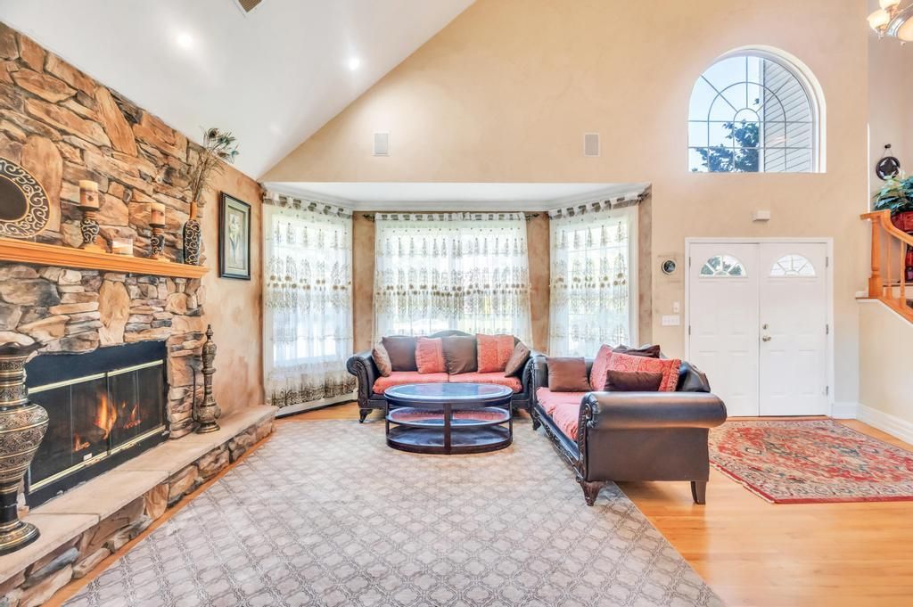 Fireplace, Interior, Living room, Recessed Lighting, Stone Walls, Wood Texture Flooring
