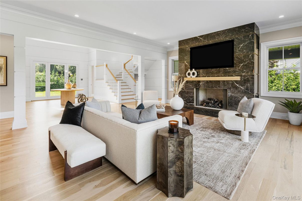 Fireplace, Interior, Living room, Marble Walls, Recessed Lighting, Wood Texture Flooring