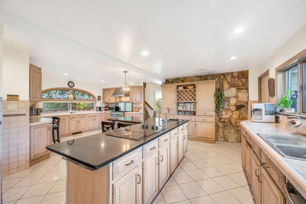 Interior, Kitchen, Pendant Lights, Recessed Lighting, Stainless Steel Appliances, Stone Walls, Tile Countertops