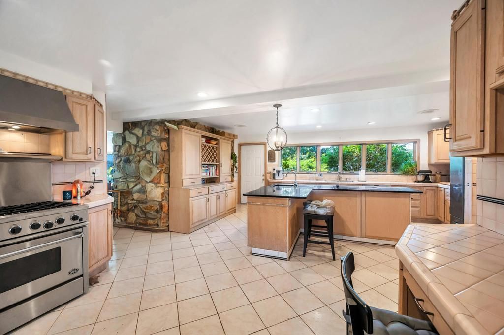 Interior, Kitchen, Pendant Lights, Recessed Lighting, Stainless Steel Appliances, Stone Walls, Tile Countertops