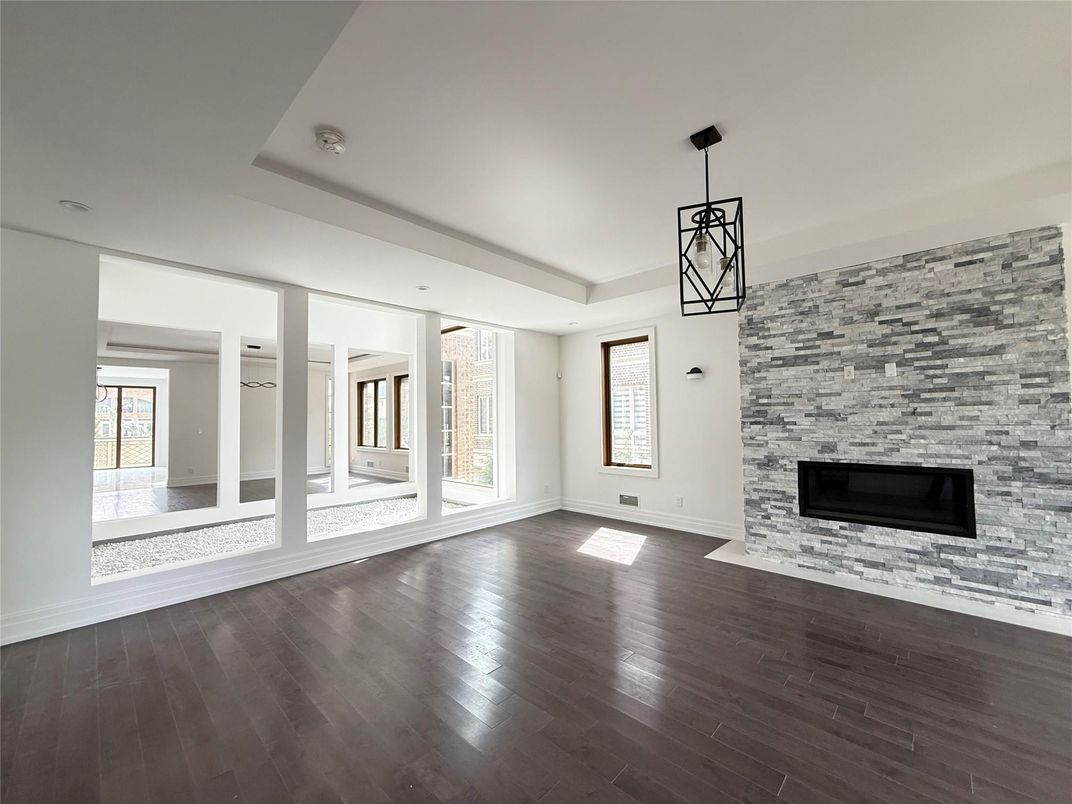 Empty room, Fireplace, Interior, Pendant Lights, Recessed Lighting, Stone Walls, Wood Texture Flooring