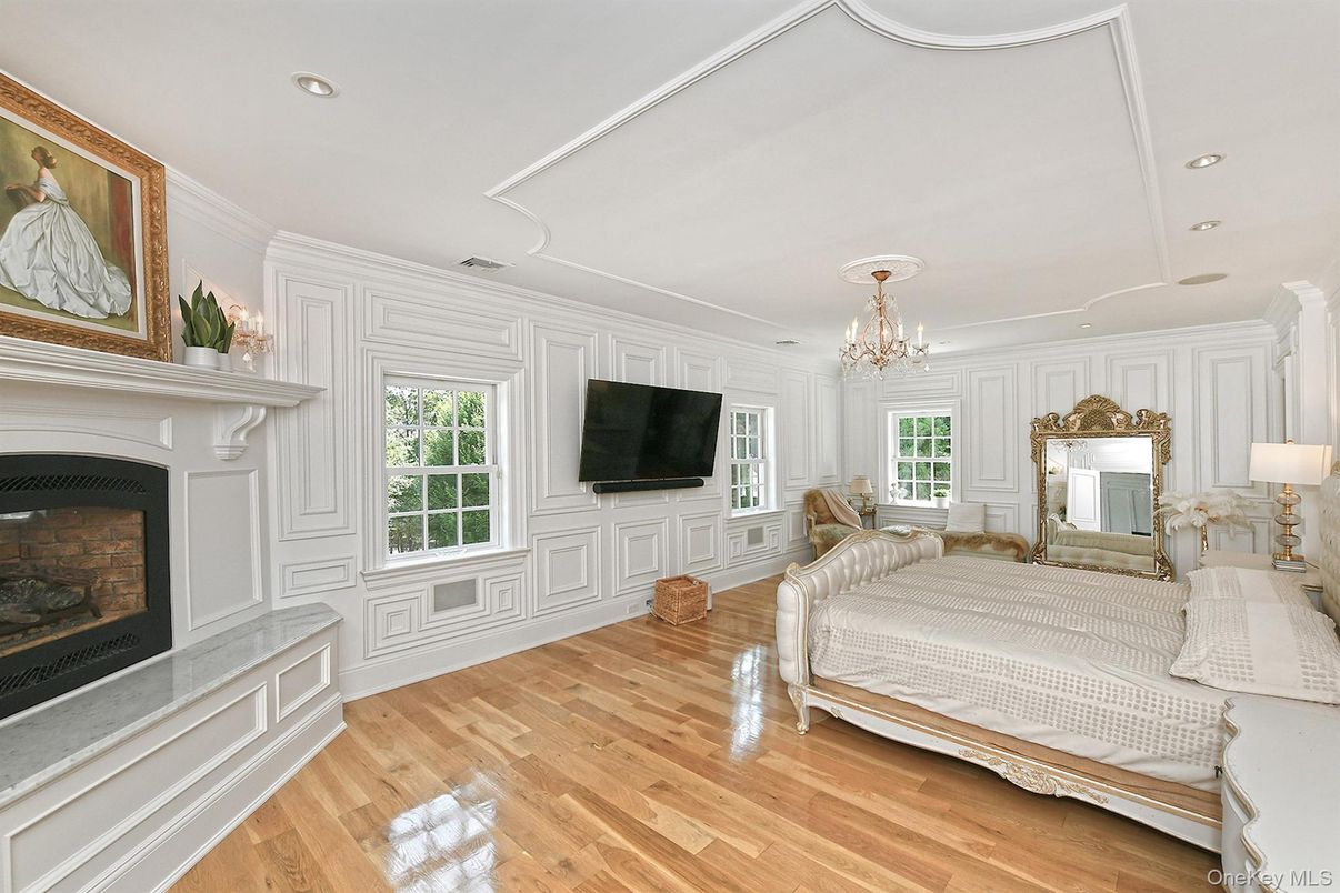 Bedroom, Chandelier, Fireplace, Interior, Recessed Lighting, Wood Texture Flooring