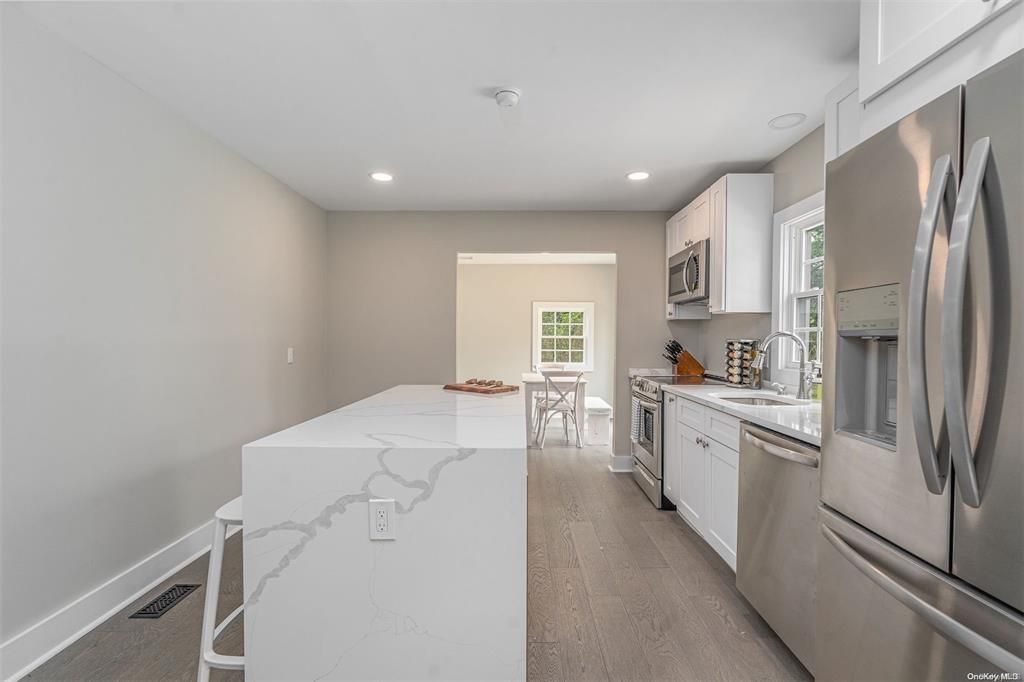 Dining room, Interior, Kitchen, Recessed Lighting, Stainless Steel Appliances, Wood Texture Flooring
