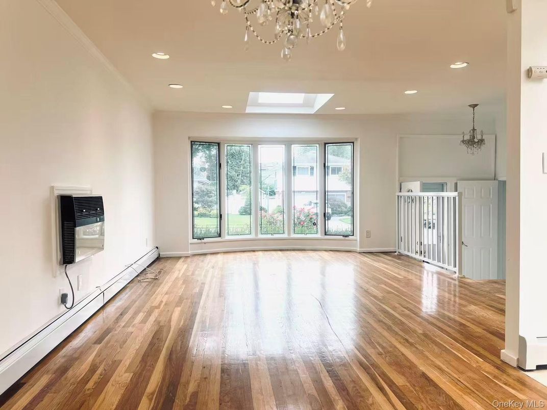 Chandelier, Empty room, Fireplace, Interior, Recessed Lighting, Wood Texture Flooring