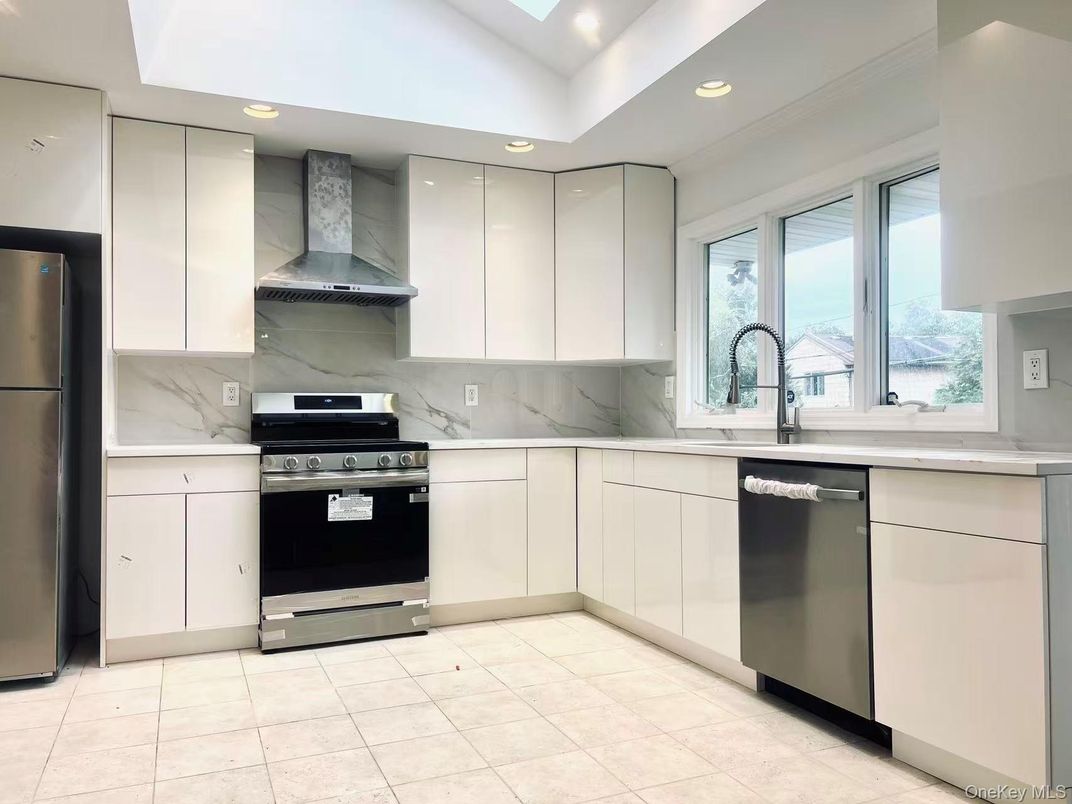 Interior, Kitchen, Marble Walls, Recessed Lighting, Stainless Steel Appliances