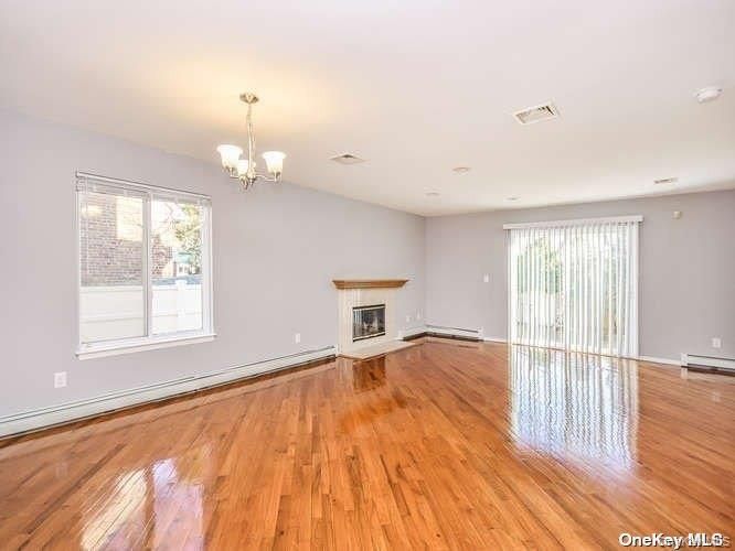 Chandelier, Empty room, Fireplace, Interior, Recessed Lighting, Wood Texture Flooring