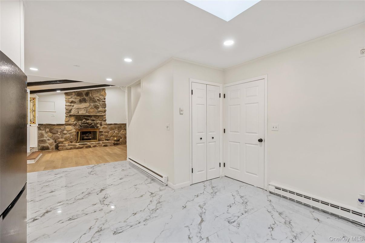 Empty room, Fireplace, Interior, Marble, Recessed Lighting, Stone Walls