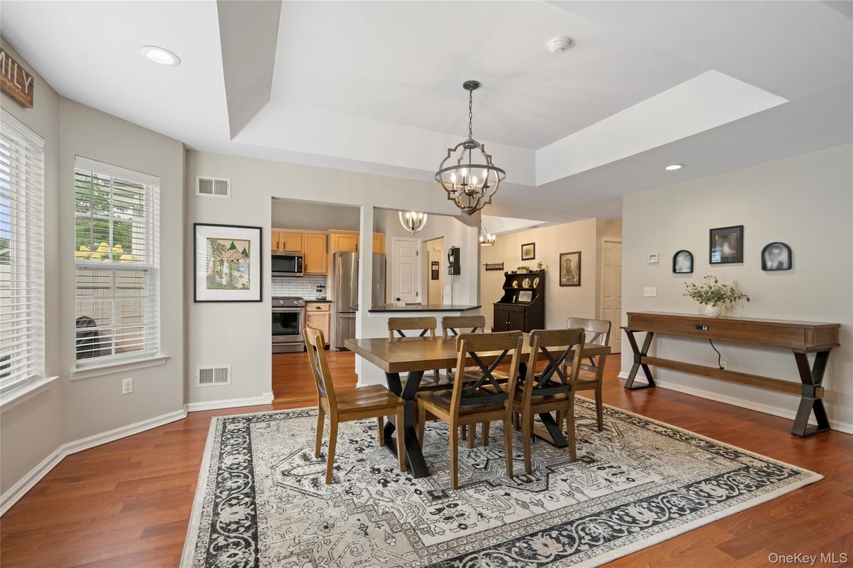 Chandelier, Dining room, Interior, Kitchen, Recessed Lighting, Stainless Steel Appliances, Wood Texture Flooring