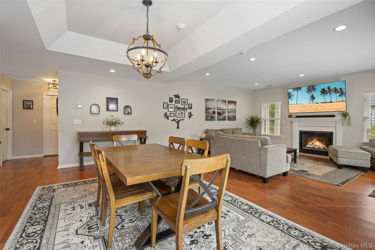 Chandelier, Dining room, Fireplace, Interior, Living room, Recessed Lighting, Wood Texture Flooring