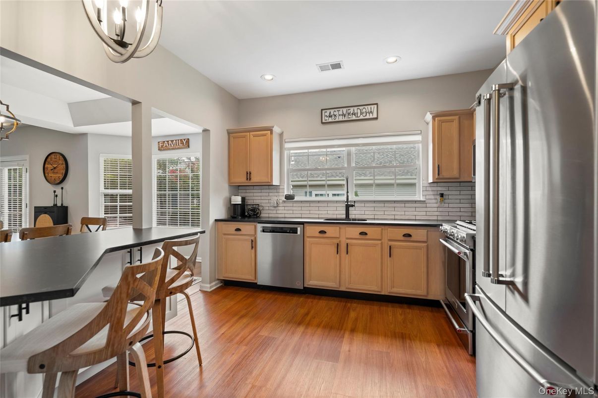 Dining room, Interior, Kitchen, Recessed Lighting, Stainless Steel Appliances, Wood Texture Flooring
