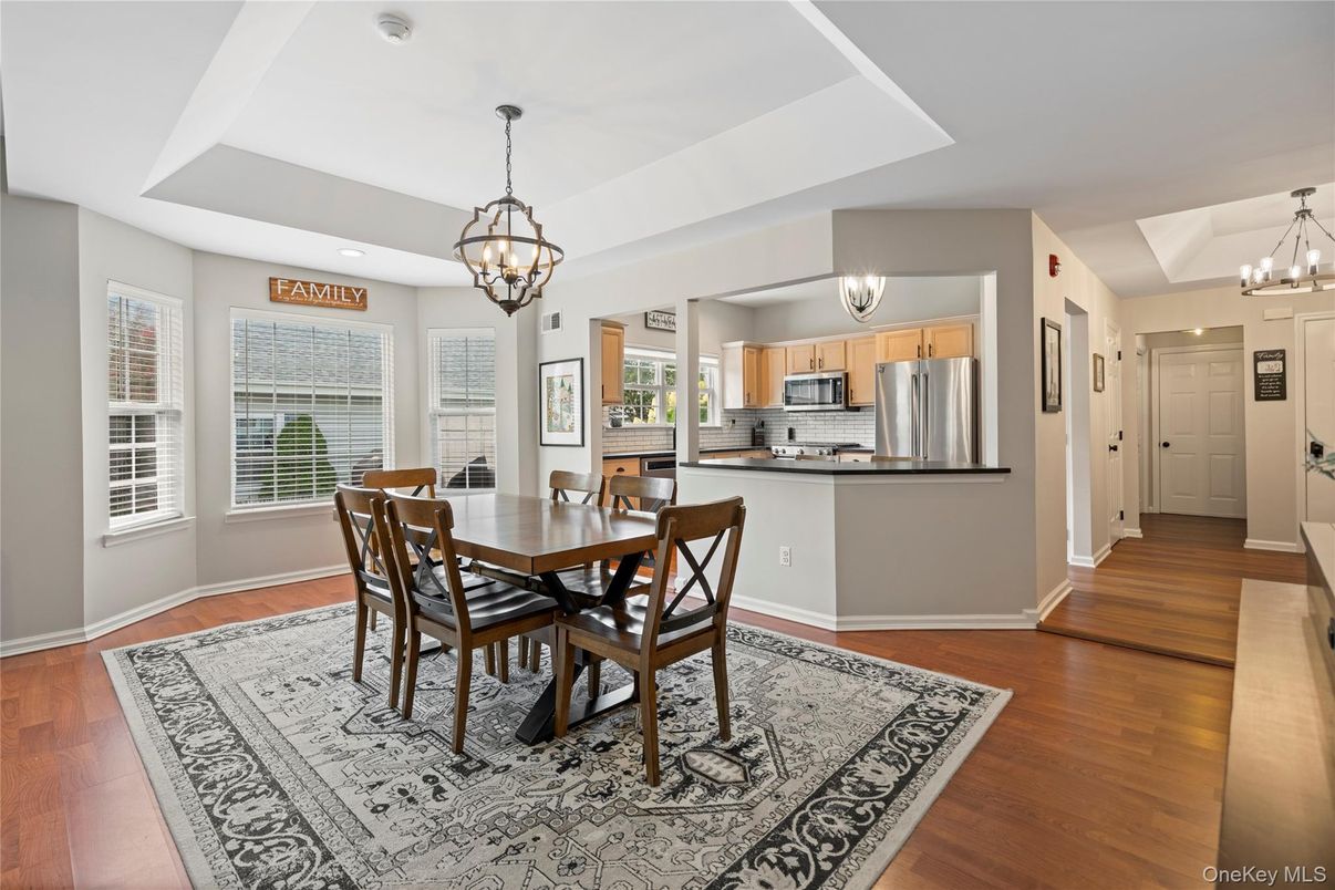 Chandelier, Dining room, Interior, Kitchen, Pendant Lights, Recessed Lighting, Stainless Steel Appliances, Wood Texture Flooring