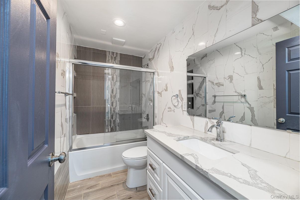 Bathroom, Glass Shower, Interior, Marble Walls, Recessed Lighting, Wood Texture Flooring