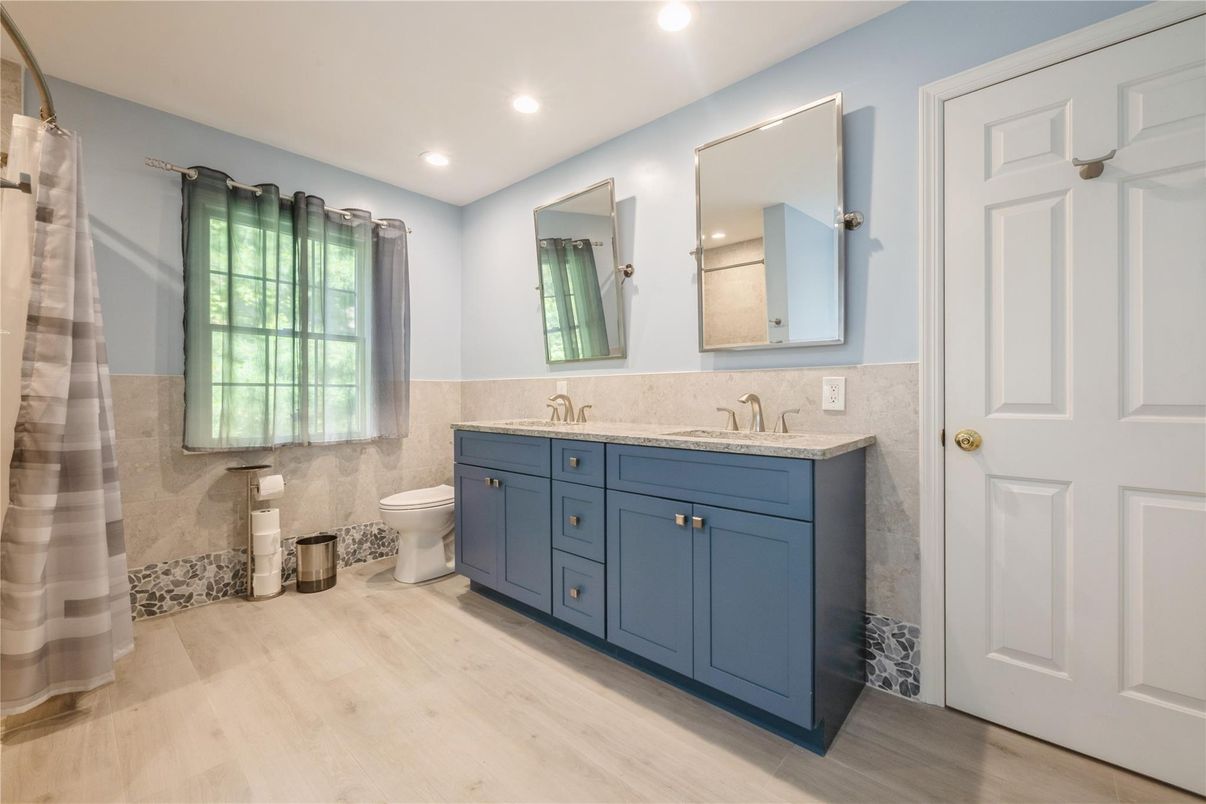 Bathroom, Dual Sink Vanities, Interior, Recessed Lighting, Wood Texture Flooring
