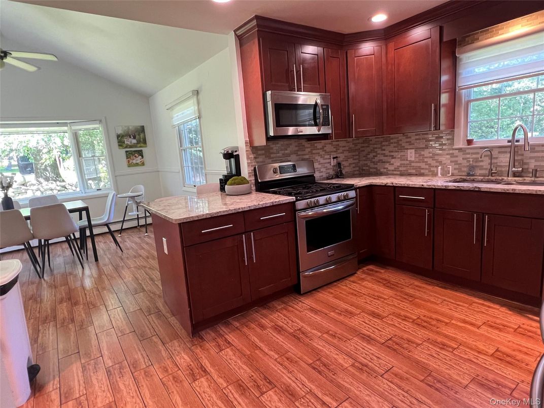 Dining room, Interior, Kitchen, Recessed Lighting, Stainless Steel Appliances, Wood Texture Flooring
