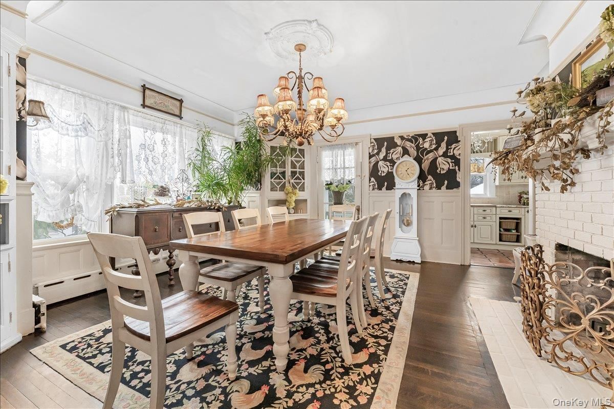 Chandelier, Dining room, Fireplace, Interior, Stone Walls, Wood Texture Flooring