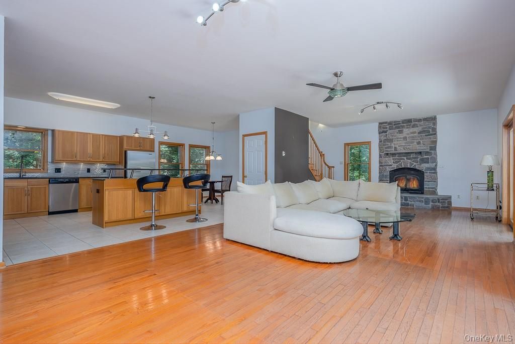 Dining room, Fireplace, Interior, Kitchen, Living room, Pendant Lights, Stone Walls, Wood Texture Flooring