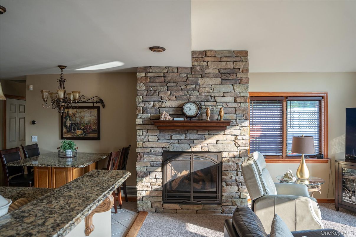 Chandelier, Dining room, Fireplace, Interior, Stone Walls