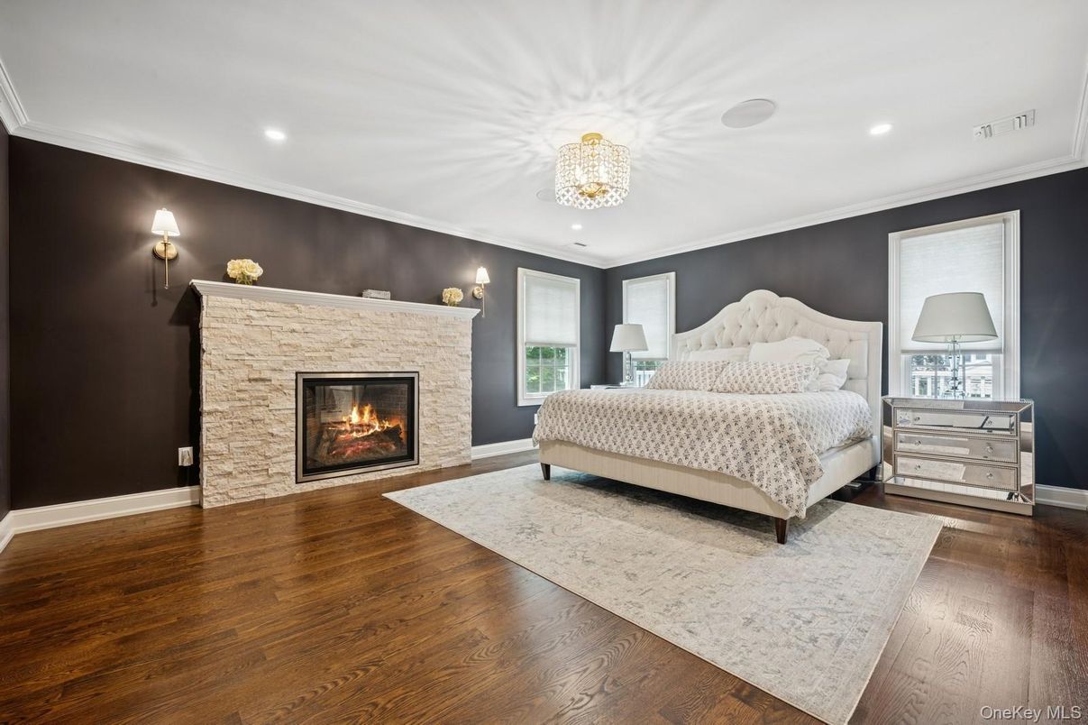 Bedroom, Chandelier, Fireplace, Interior, Recessed Lighting, Wood Texture Flooring