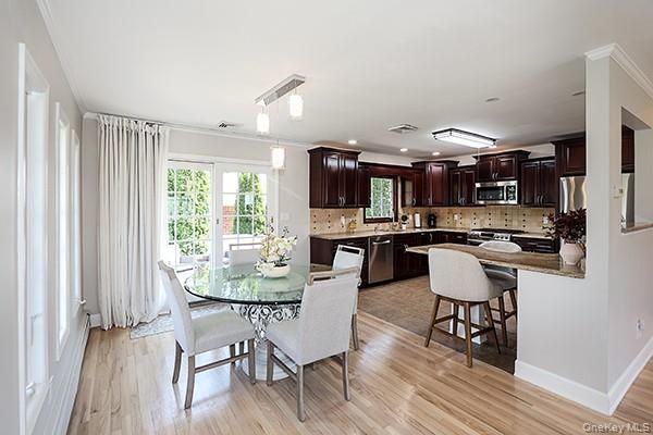 Dining room, Interior, Kitchen, Recessed Lighting, Stainless Steel Appliances, Wood Texture Flooring