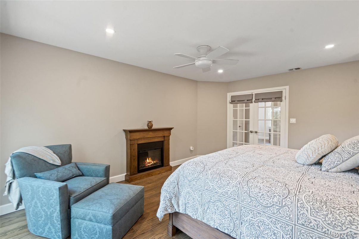 Bedroom, Fireplace, Interior, Recessed Lighting, Wood Texture Flooring