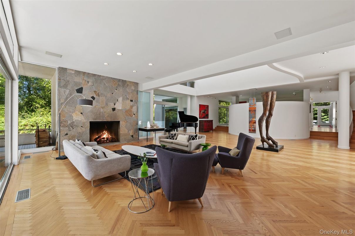 Fireplace, Interior, Living room, Piano, Recessed Lighting, Stone Walls, Wood Texture Flooring