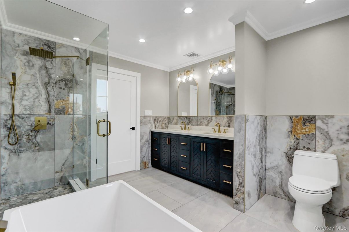 Bathroom, Dual Sink Vanities, Glass Shower, Interior, Marble Walls, Recessed Lighting