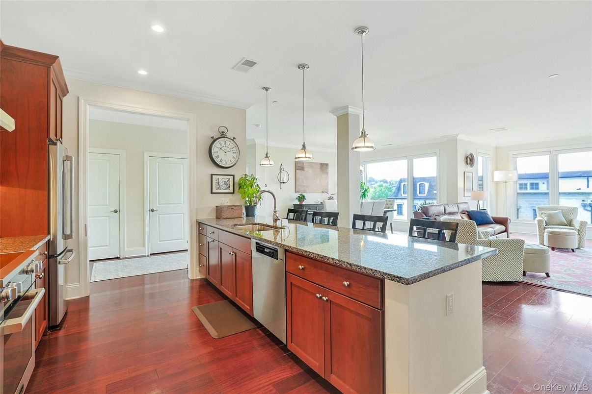 Dining room, Interior, Kitchen, Living room, Pendant Lights, Recessed Lighting, Stainless Steel Appliances, Water, Wood Texture Flooring