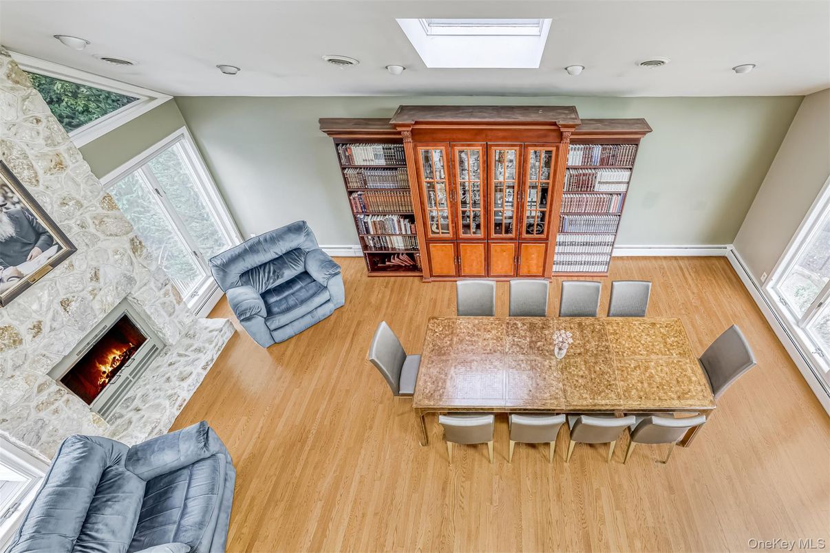 Dining room, Fireplace, Interior, Living room, Recessed Lighting, Wood Texture Flooring
