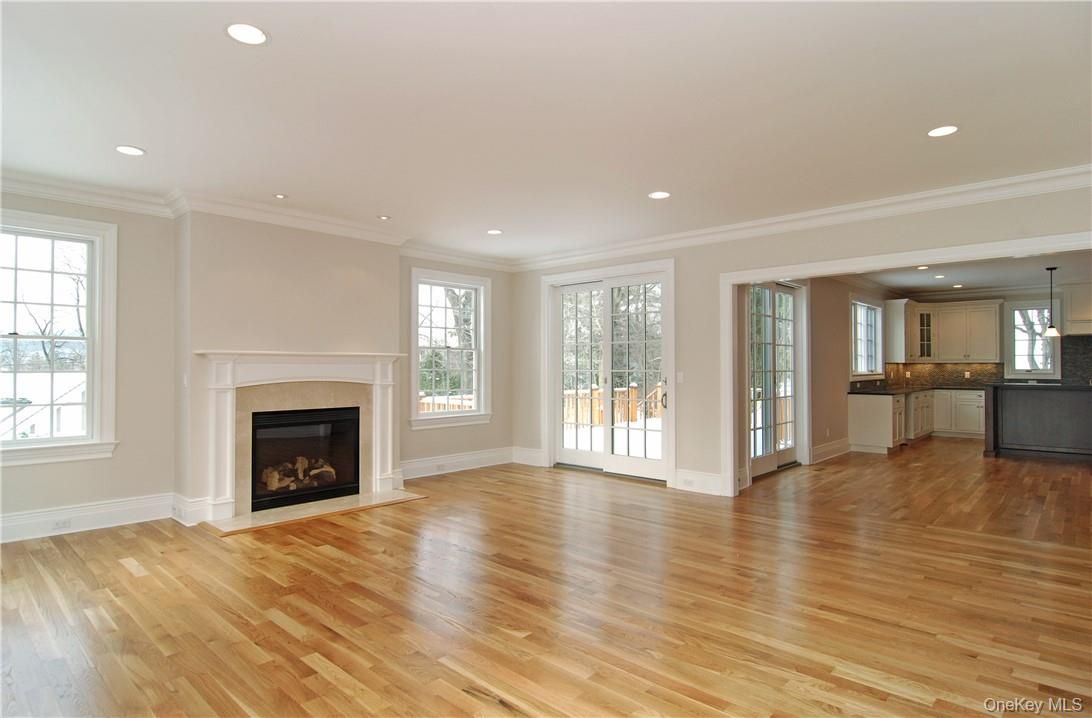 Empty room, Fireplace, Interior, Kitchen, Pendant Lights, Recessed Lighting, Wood Texture Flooring