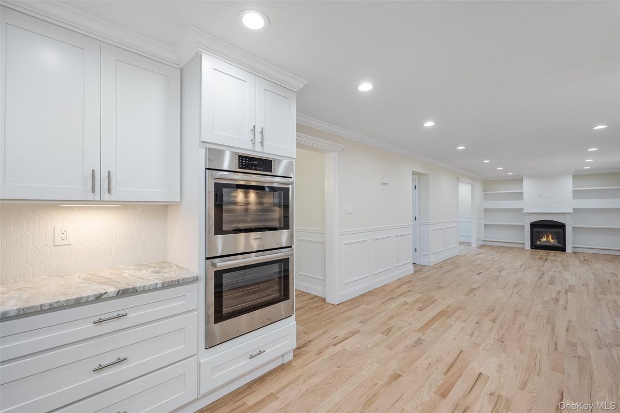 Fireplace, Interior, Kitchen, Recessed Lighting, Stainless Steel Appliances, Wood Texture Flooring