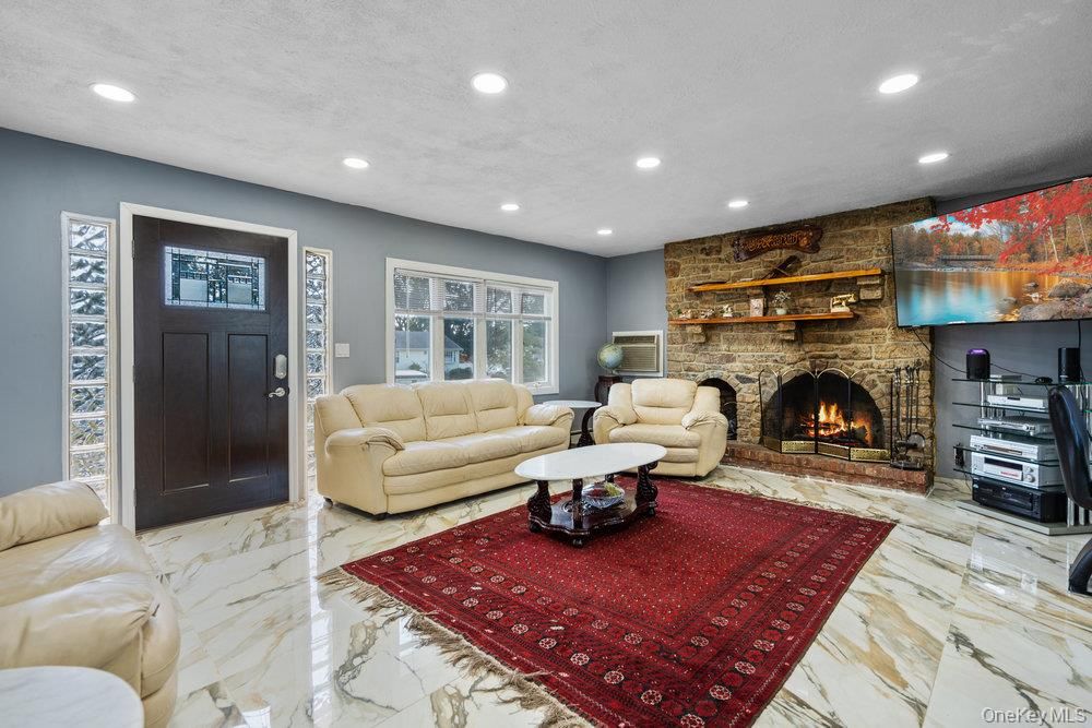Fireplace, Interior, Living room, Marble, Recessed Lighting, Stone Walls