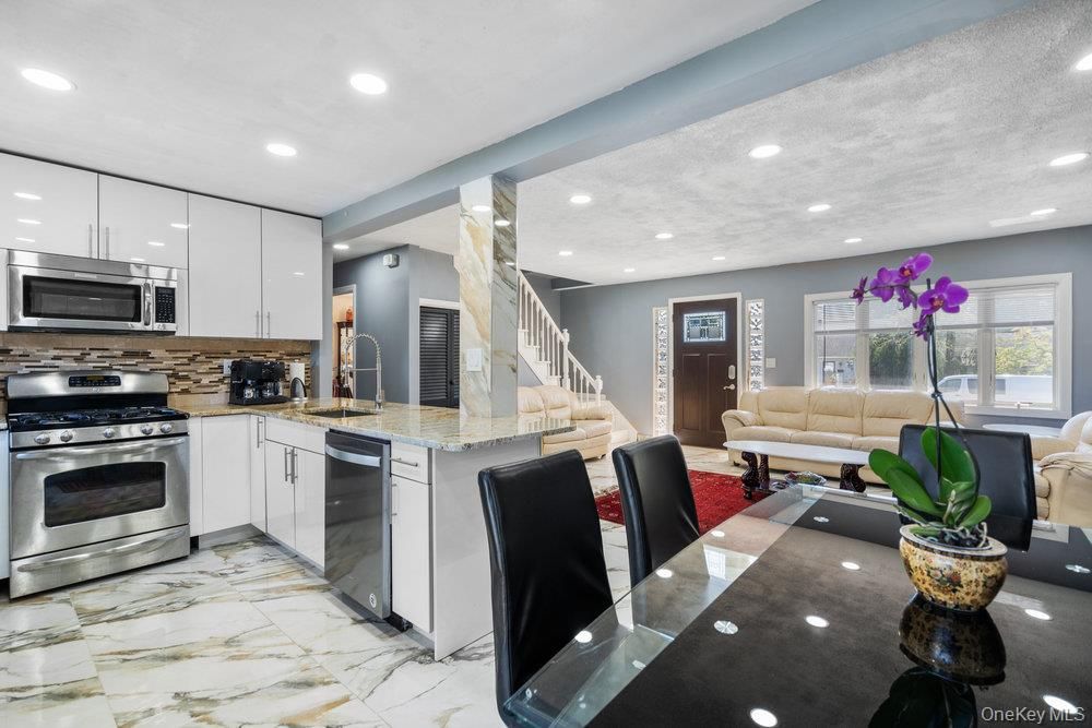 Dining room, Interior, Kitchen, Living room, Marble, Recessed Lighting, Stainless Steel Appliances