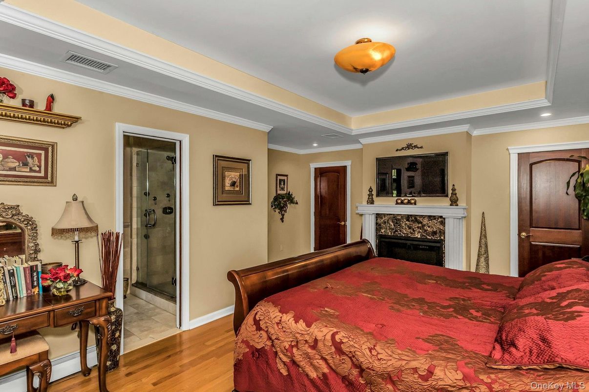 Bedroom, Fireplace, Interior, Recessed Lighting, Wood Texture Flooring