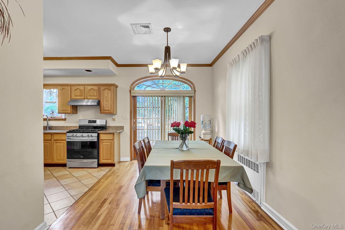 Chandelier, Dining room, Interior, Kitchen, Stainless Steel Appliances, Wood Texture Flooring